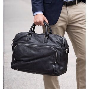 Danier black leather laptop bag with tons of sections for work
Or school unisex